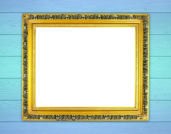 Lege gouden frame op houten muur — Stockfoto