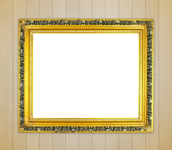 Lege gouden frame op houten muur — Stockfoto