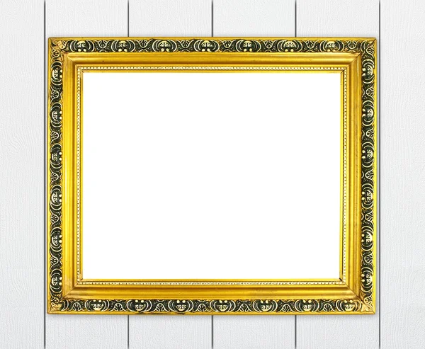 Lege gouden frame op houten muur — Stockfoto