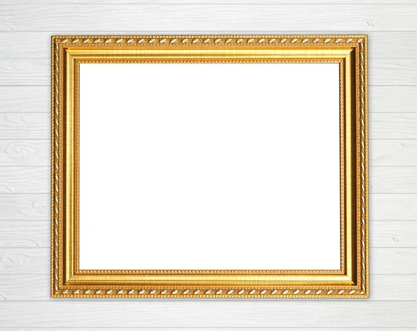 Lege gouden frame op houten muur — Stockfoto