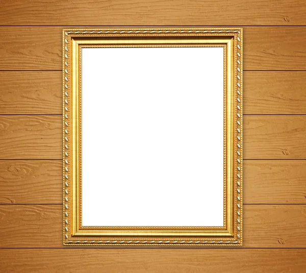 Lege gouden frame op houten muur — Stockfoto