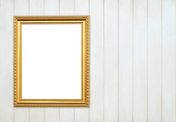 Lege gouden frame op houten muur — Stockfoto