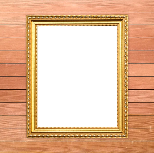 Lege gouden frame op houten muur — Stockfoto