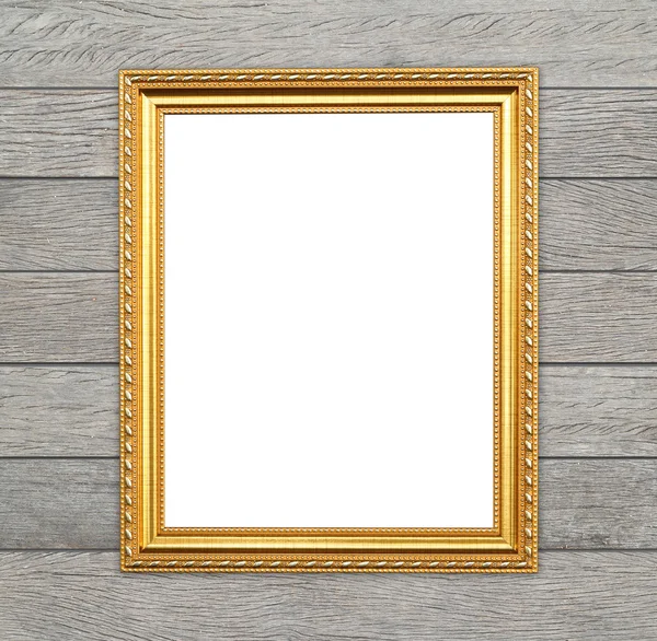 Lege gouden frame op houten muur — Stockfoto