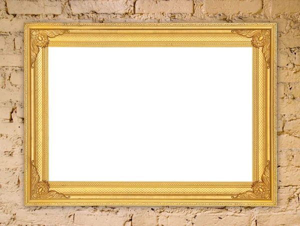Marco de oro en blanco en la pared de piedra de ladrillo — Foto de Stock
