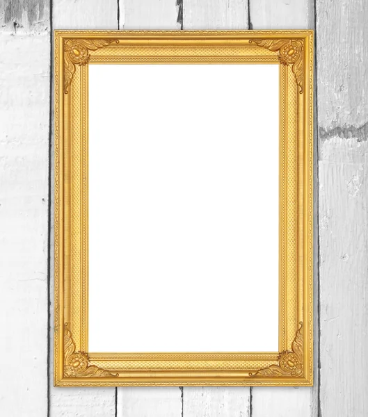 Leerer goldener Rahmen an Holzwand — Stockfoto