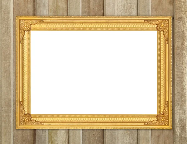 Lege gouden frame op houten muur — Stockfoto