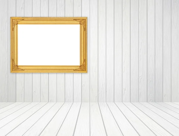 Blank golden frame in room with white wood wall and wood floor — Stock Photo, Image