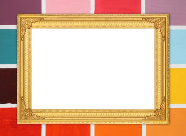 Blank golden frame on colorful wood wall — Stock Photo, Image