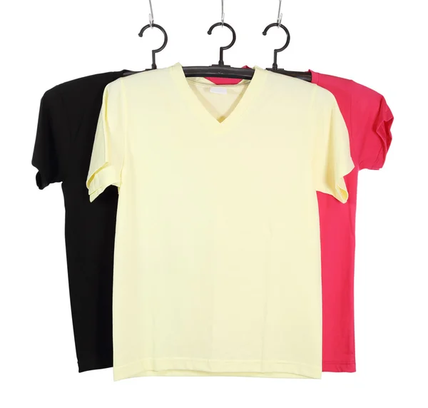 Plantilla de tres camisetas en percha aislada en blanco —  Fotos de Stock