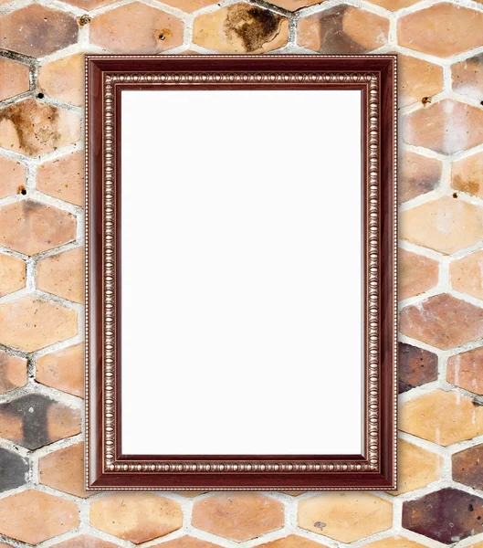 Houten frame op zeshoekige klei muur — Stockfoto