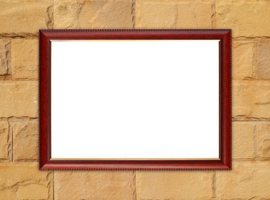 tuğla duvarın üzerinde boş ahşap çerçeve 