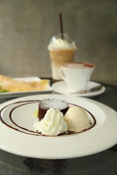 Chocolate Lava Cake with ice cream and beverage — Stock Photo, Image