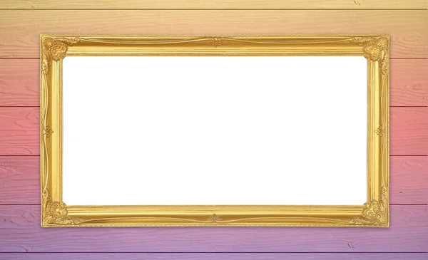 Zlatý rám na barevné dřevěné zdi pozadí — Stock fotografie