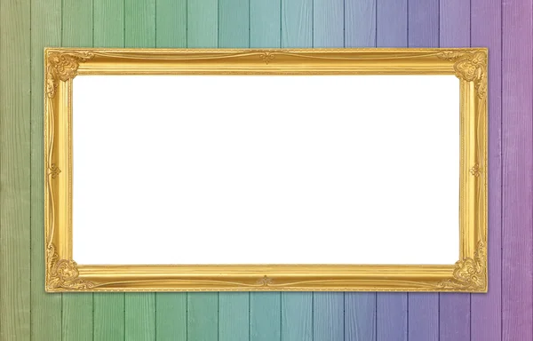 Golden frame on colorful wood wall background — Stock Photo, Image