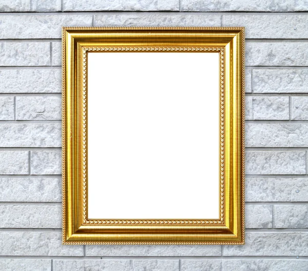 Gouden frame op baksteen stenen muur achtergrond — Stockfoto