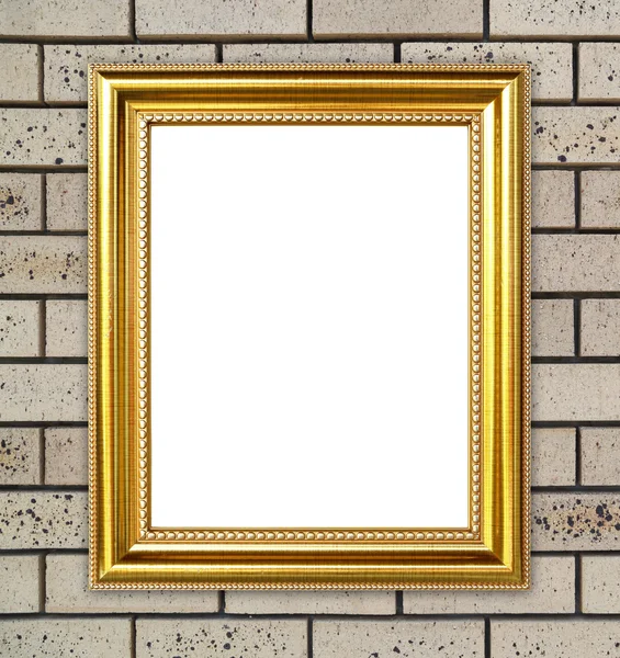 Gouden frame op baksteen stenen muur achtergrond — Stockfoto