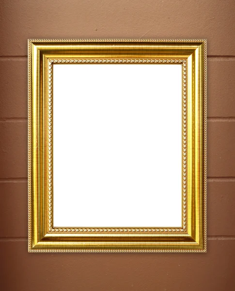 Порожня золота рамка на фоні цементної стіни — стокове фото