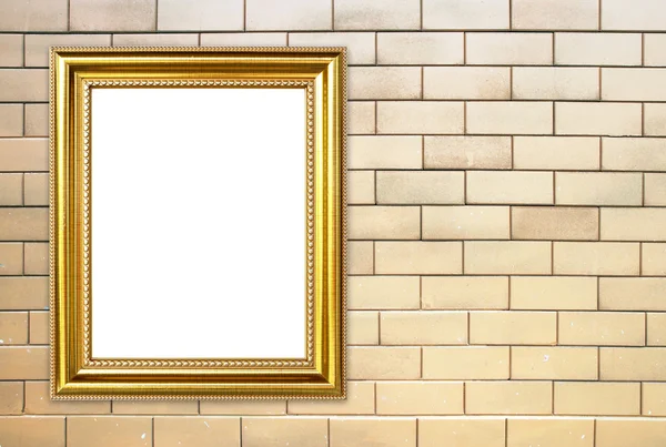 Gouden frame op baksteen stenen muur achtergrond — Stockfoto