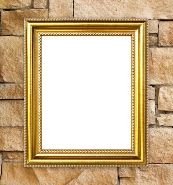 Moldura dourada no fundo da parede de pedra de tijolo — Fotografia de Stock
