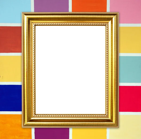 Golden frame on colorful wood wall background — Stock Photo, Image