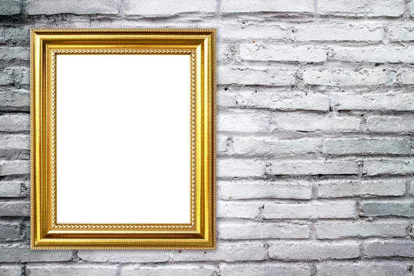 Gouden frame op baksteen stenen muur achtergrond — Stockfoto