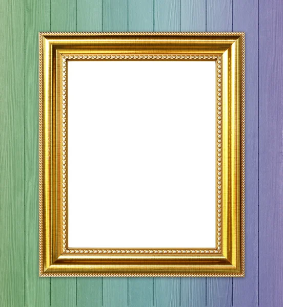 Golden frame on colorful wood wall background — Stock Photo, Image