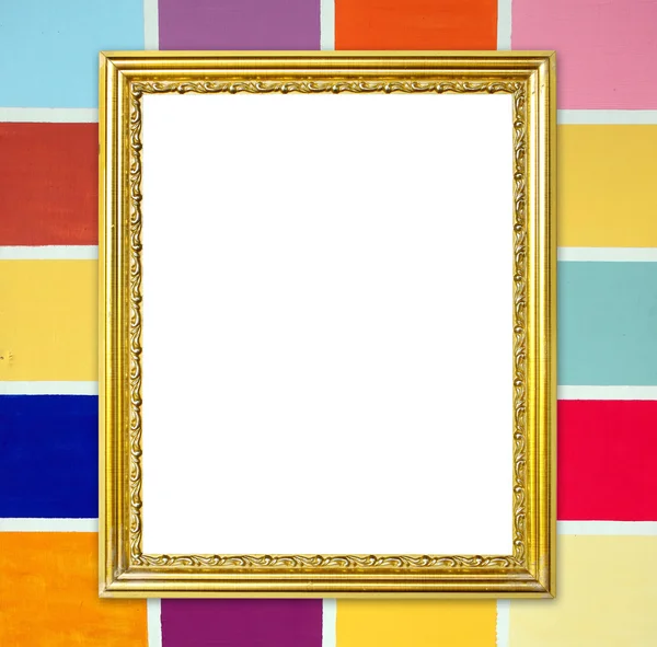 Golden frame on colorful wood wall background — Stock Photo, Image