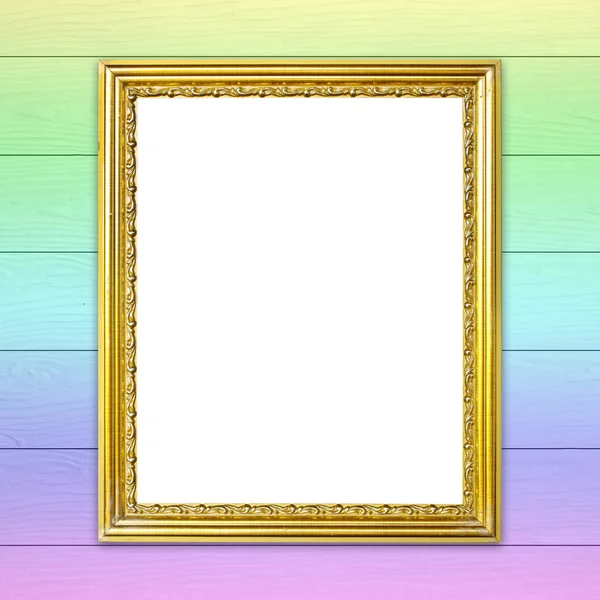 Golden frame on colorful wood wall background — Stock Photo, Image
