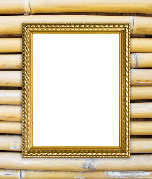 Золотая рамка на фоне бамбуковой стены — стоковое фото