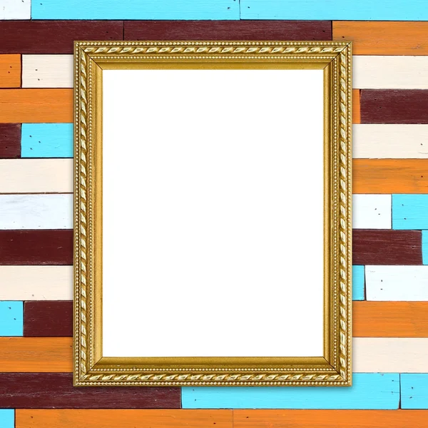 Golden frame on colorful wood wall background — Stock Photo, Image