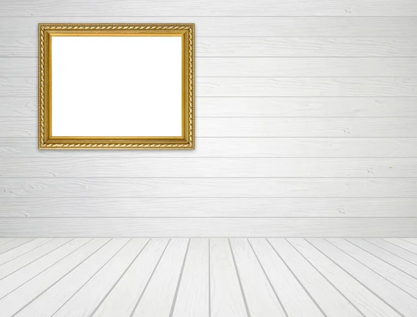 Cornice dorata in camera con parete in legno bianco e pavimento in legno backgro — Foto Stock