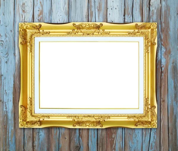 Gouden frame op houten muur achtergrond — Stockfoto