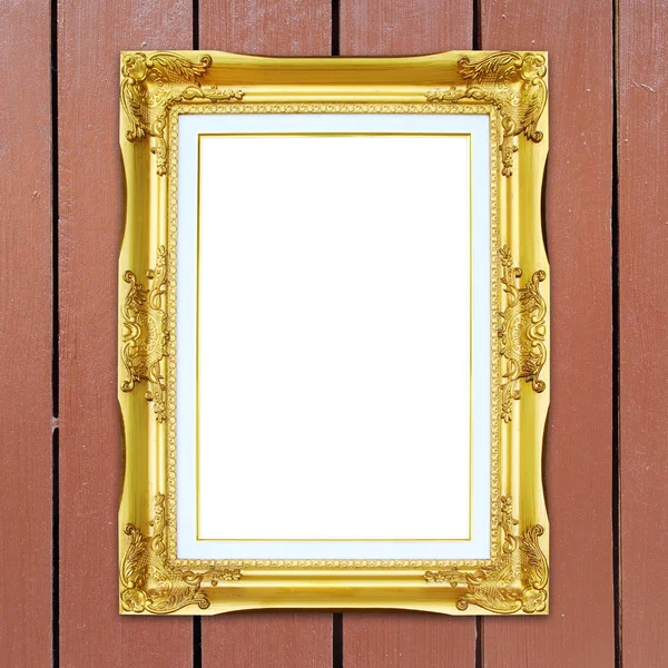 Cornice dorata su fondo parete in legno — Foto Stock