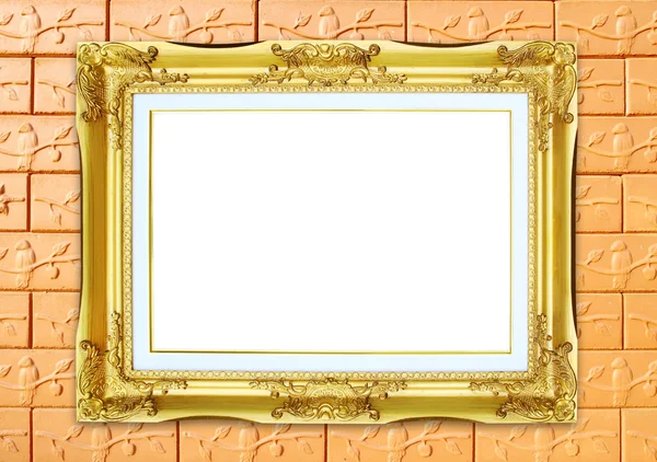 Złotą ramę na tle kamienny mur ceglany — Zdjęcie stockowe