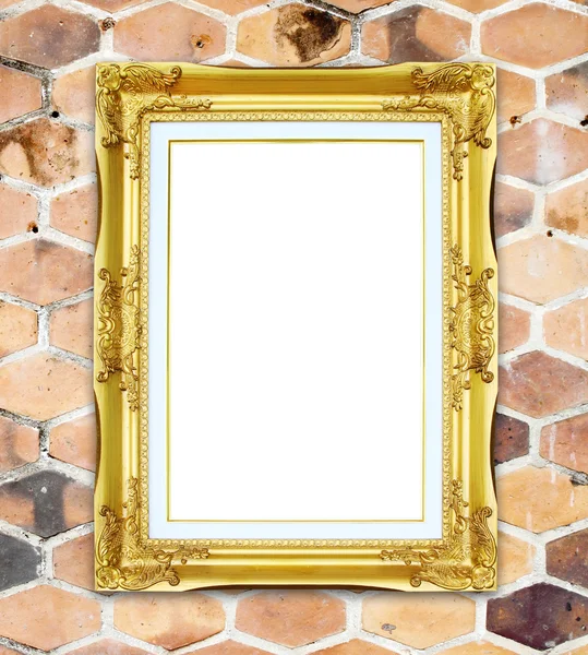 Golden frame on brick hexagonal stone wall background — Stock Photo, Image