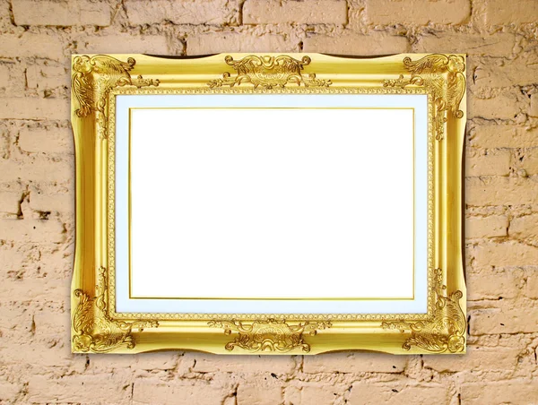 Marco dorado sobre fondo de pared de piedra de ladrillo —  Fotos de Stock