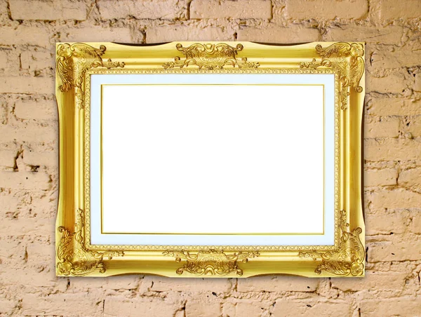 Gouden frame op baksteen stenen muur achtergrond — Stockfoto