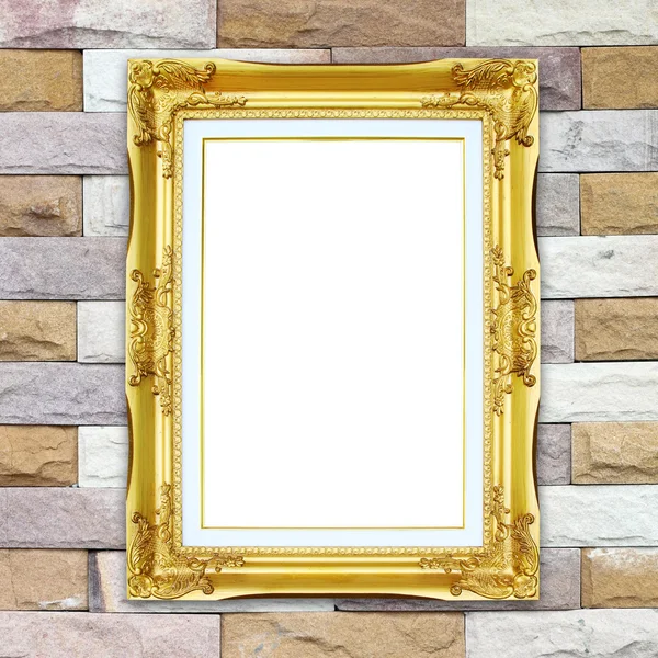 Golden frame on brick stone wall background — Stock Photo, Image