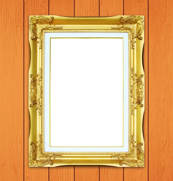 Golden frame on wood wall background — Stock Photo, Image