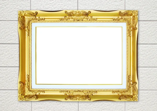 Gouden frame op baksteen stenen muur achtergrond — Stockfoto