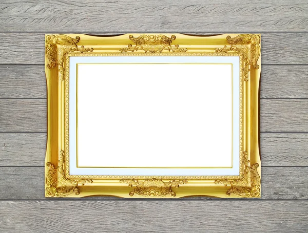 Golden frame on wood wall background — Stock Photo, Image