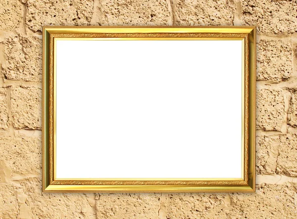 Marco dorado sobre fondo de pared de piedra de ladrillo — Foto de Stock