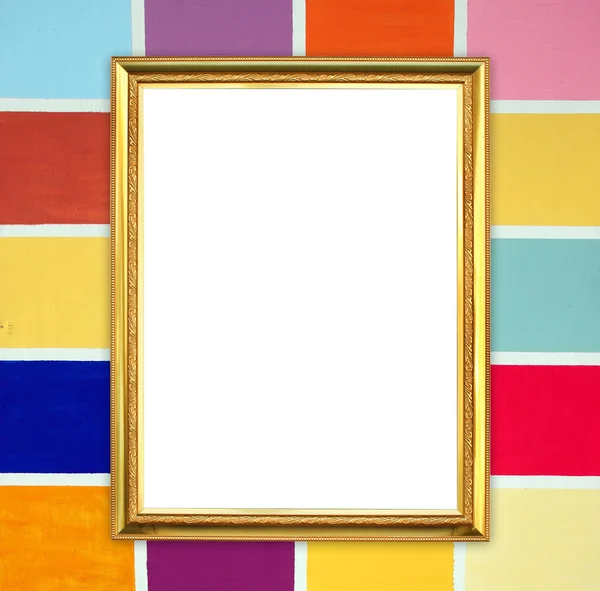 Golden frame on colorful wood wall background — Stock Photo, Image