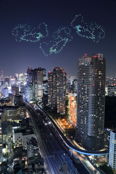 Heart sparkle Fireworks celebrating over Tokyo cityscape at night, Japan