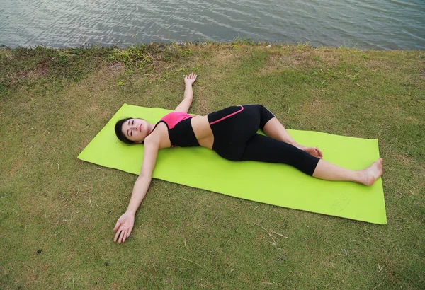 Young woman doing yoga exercise — Stock Photo, Image