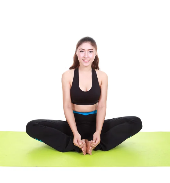 Young woman doing yoga exercise with yoga mat — Stock Photo, Image