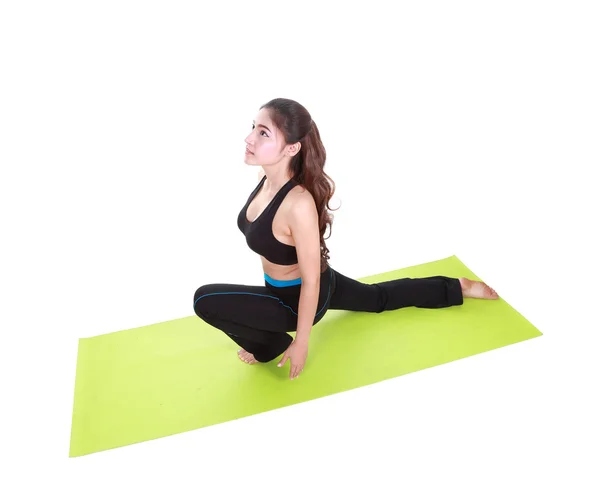 Young woman doing yoga exercise with yoga mat — Stock Photo, Image