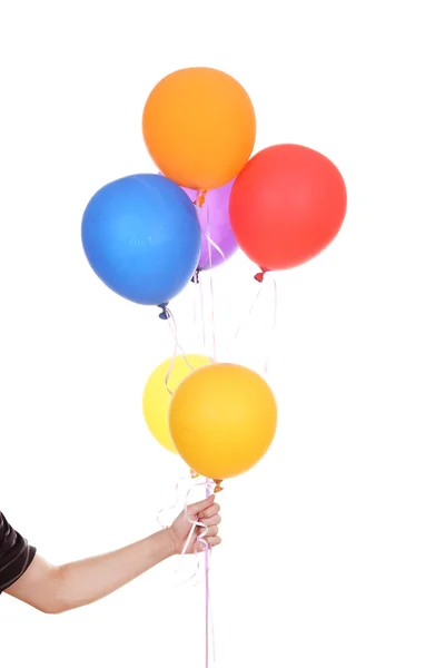 Hand met kleurrijke ballonnen — Stockfoto