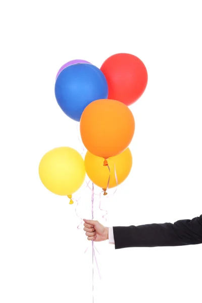 Zakelijke hand met kleurrijke ballonnen — Stockfoto